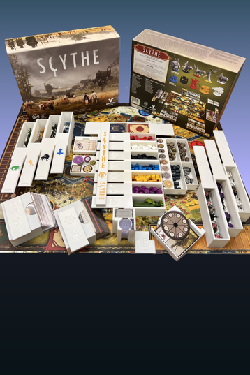 Scythe board game components including cards, pieces, and box neatly organized in a RiverCross Diorama insert on a blue background